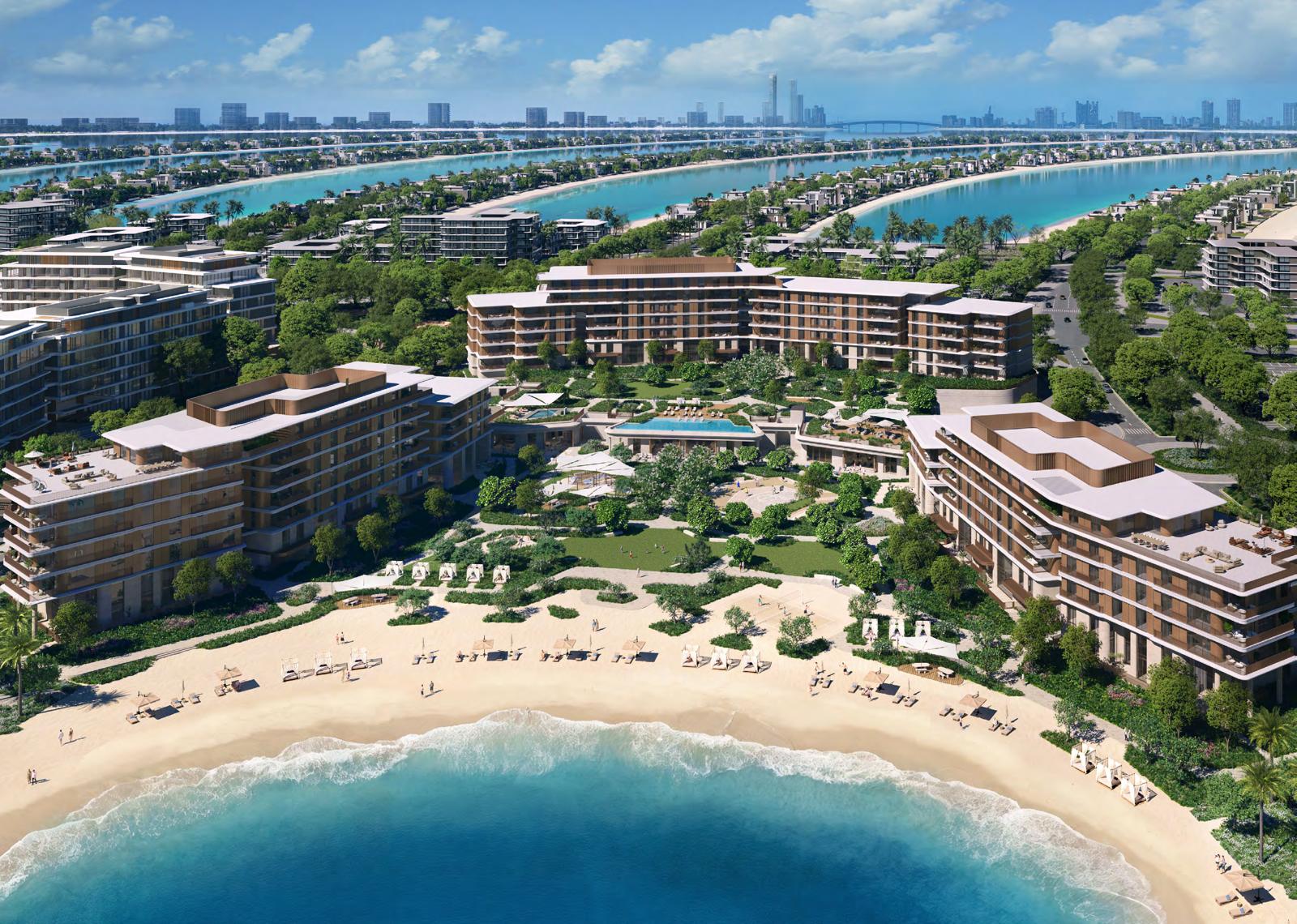Aerial view of the three Palm Central buildings and beach